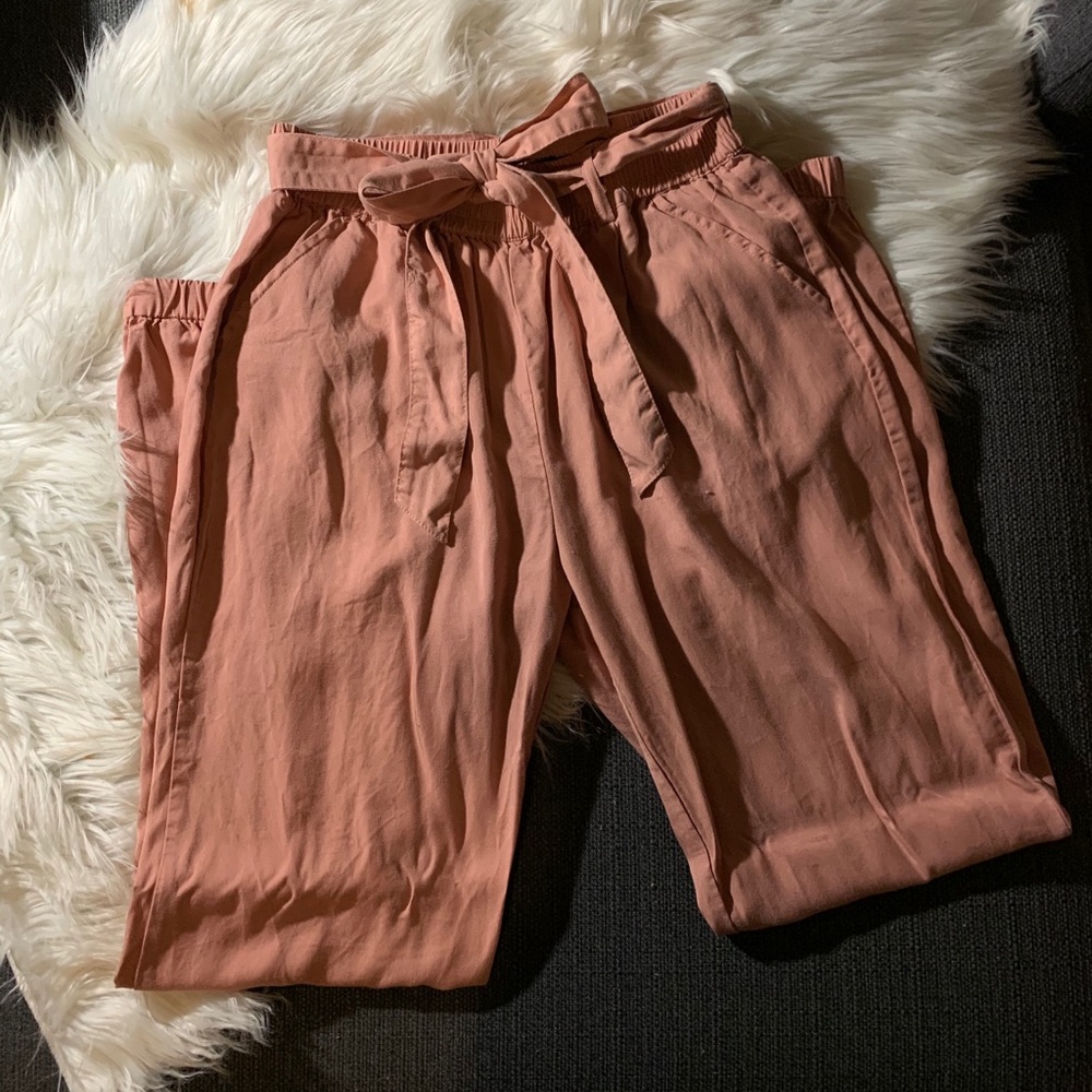 Pink joggers with a sash belt